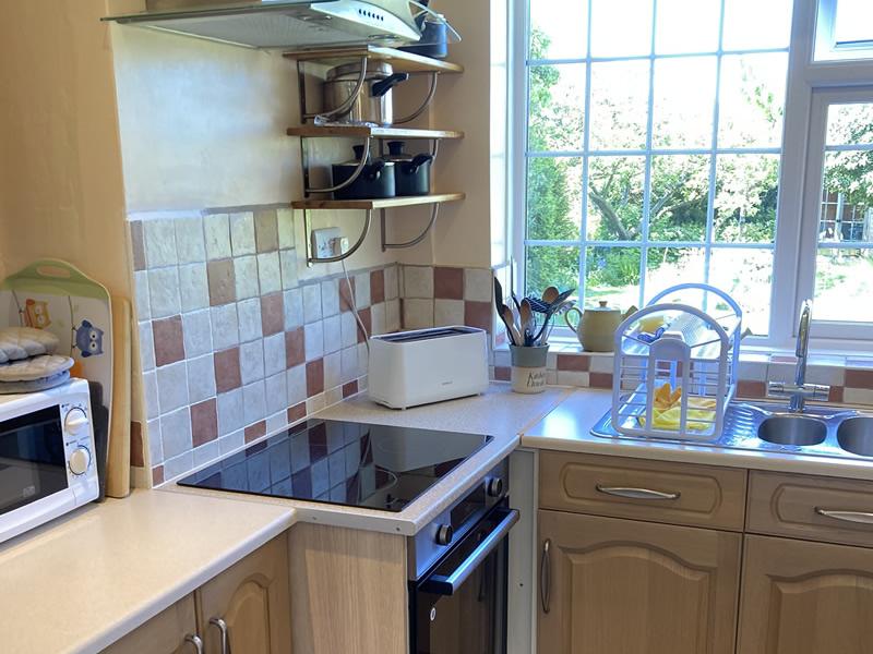 kitchen with electric oven and induction hob